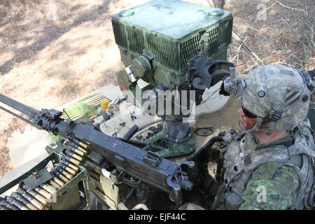 Spc. Stephen Patz, a cavalry scout with Troop A, 6th Squadron, 8th Cavalry Regiment, 4th Infantry Brigade Combat Team, 3rd Infantry Division, observes for enemy movement while mounted on a Humvee on Fort Stewart, Ga., March 9, 2015, during Vanguard Focus, a brigade level training exercise to validate the unit’s combat readiness. U.S. Army  Sgt. Joshua Laidacker, 4th IBCT, 3rd ID, Public Affairs Stock Photo