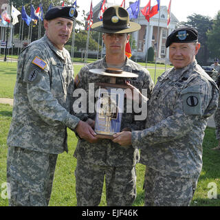 Staff Sgt. Michael Johnston from Fort Benning, Ga., won the active-duty 2009 Drill Sergeant of the Year title at Continental Park on Fort Monroe, Va. Johnston is presented with the Drill Sergeant of the Year trophy by Command Sgt. Maj. David Bruner and Gen. Martin E. Dempsey of the U.S. Army Training and Doctrine Command          Army names top drill sergeants for 2009  /-news/2009/06/26/23536-army-names-top-drill-sergeants-for-2009/?ref=news-home-title7 Stock Photo