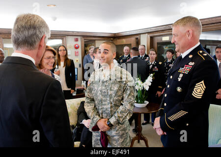 Pfc. Eddie Munoz, 3rd Brigade Combat Team, 47th Calvary Regiment, Fort Bragg, N.C., speaks with Secretary of the Army John McHugh and Sgt. Maj. of the Army Raymond F. Chandler III, prior to the Army's 237th Birthday Week kick-off event at George Washington's Mount Vernon estate, Alexandria, Va., June 11, 2012. Munoz, who is recovering from wounds received in Afghanistan, was one of three Soldiers presented the Purple Heart medal during the ceremony June 11, 2012. George Washington established the Purple Heart award during the Revolutionary War. Stock Photo
