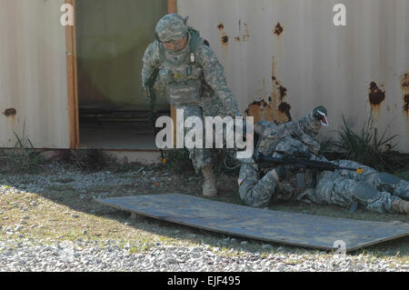 Capt James Felts of 30th Brigade Combat Team, Headquarters, Headquarters Company evacuates battle buddy out of kill zone after being wounded by insurgents. The wounded Soldier is given a &quot;stress card,&quot; explaining, in detail, what specific types of wounds the Soldier has. The mobile Soldiers will be evaluated on how well he provides first aid to the wounded Soldiers. Stock Photo