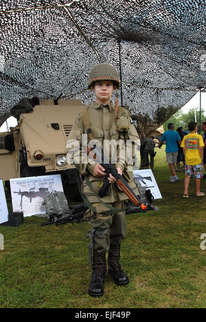 A young boy dressed in an old paratrooper uniform stands ready during the 69th National Airborne Day celebration at the Airborne and Special Operations Museum in downtown Fayetteville, N.C., Aug. 15, 2009. Many volunteer re-enactors came out for Airborne Day dressed in authentic uniforms from World War II through today.    Spc. Gregory Argentieri         National Airborne Day marks first jump in 1940  /-news/2009/08/21/26397-national-airborne-day-marks-first-jump-in-1940/ Stock Photo