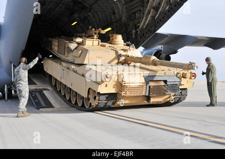 COLORADO SPRINGS, Colo. – Soldiers from 1st Battalion, 68th Armor Regiment, 3rd Armored Brigade Combat Team, 4th Infantry Division, conducted a joint air mobility exercise with Airmen from the 21st Airlift Squadron, 60th Air Mobility Wing, Travis Air Force Base, Cali., Jan. 13-17, 2014, at Fort Carson’s Arrival/Departure Airfield Control Group airfield. The exercise was held in order to validate air loads on a C-17 Globemaster military transport aircraft as part of the Global Response Force mission to rapidly deploy worldwide in support of the XVIII Airborne Corps. The joint exercise also focu Stock Photo