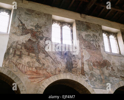 Medieval (1450-60) frescoes in Pickering church, North Yorkshire, depicting St George and the Dragon, and St Christopher carrying the Infant Jesus. Stock Photo