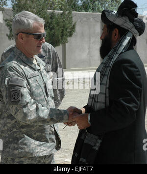 U.S. Army Gen. Dan McNeill, the commander of International Security Assistance greets Delbar Jan Arman,the governor of Zabul, in Qalat, Afghanistan, March 31, 2008. The general and the governor met to discuss security, education and narcotics concerns in Zabul.  Capt. Jean Duggan Released Stock Photo