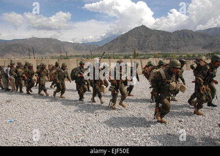 U.S. Army Soldiers from 2nd Battalion, 503rd Infantry Regiment, 173rd Airborne Brigade Combat Team, Afghan National Army soldiers, and members of the Afghan Border Patrol prepare to conduct training on how to enter and exit a CH-47 Chinook helicopter in preparation for a combat operation April 11, 2008, on Forward Operating Base Fortress. in the Konar province of Afghanistan.   Sgt. Johnny R. Aragon Released Stock Photo