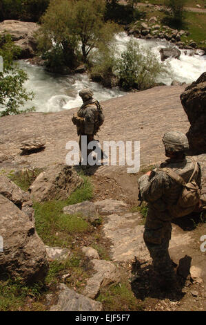 U.S. Army Soldiers of the Kalagush provincial reconstruction team conduct village assessments in the Nuristan province of Afghanistan June 26, 2007.  Staff Sgt. Isaac A. Graham Stock Photo