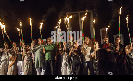 Dhaka, Bangladesh. 25th Mar, 2015. Dhaka, Bangladesh - Bangladeshi social activists hold candles during a rally in remembrance of those who were killed on this night in 1971, a day ahead of the country's declaration of independence from Pakistan. On this black night in their national history, the Pakistani military rulers launched ''Operation Searchlight'' killing some thousand people in that night crackdown alone. © Zakir Hossain Chowdhury/ZUMA Wire/Alamy Live News Stock Photo