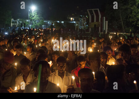 Dhaka, Bangladesh. 25th Mar, 2015. Dhaka, Bangladesh, Wednesday, March 25, 2015 ; Bangladeshi social activists hold candles during a rally in remembrance of those who were killed on this night in 1971, a day ahead of the country's declaration of independence from Pakistan.On this black night in the nationl history, the Pakistani military rulers launched ''Operation Searchlight'' killing some thousand people in that night crackdown alone. As part of the operation, tanks rolled out of Dhaka cantonment and a sleeping city woke up to the rattles of gunfire as the Pakistan army attacked the ha Stock Photo