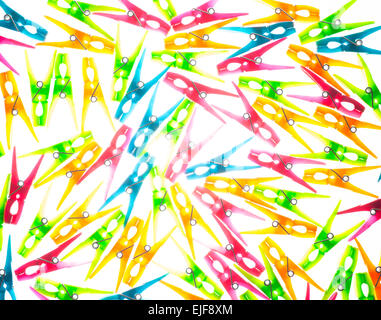 Colourful translucent clothes pegs Stock Photo