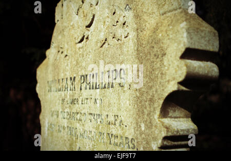 Old Victorian grave headstone in a cemetery in Wales with the surname of Phillips Stock Photo