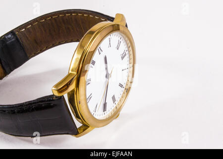 A leather and gold wrist watch