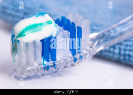 toothbrush and toothpaste, towel, water spray. close-up Stock Photo