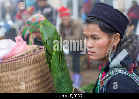 Young Hmong woman at a market in Sapa, Vietnam Stock Photo