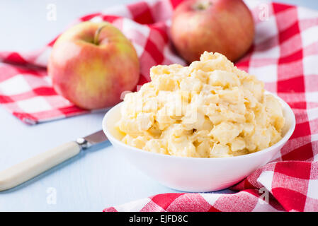 Apples with vanilla custard in a bowl. Apple pie filling. Baking ingredients, selective focus Stock Photo