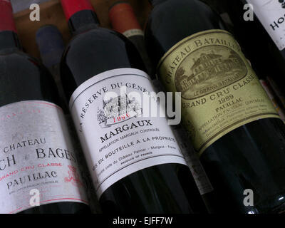 Bottles of Chateau Batailley & Chateau Lynch Bages Pauillac and Chateau Palmer Margaux 1996 Bordeaux fine vintage wine in restaurant cellar Stock Photo