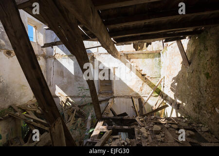 Wooden beams in derelict abandoned house ruin in ancient mountain village of Old Perithia - Palea Peritheia, Corfu, Greece Stock Photo