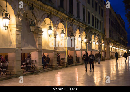 People strolling along the arcades of the Liston at night at the Spianada in Kerkyra, Corfu Town, Greece Stock Photo