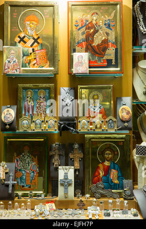 Display of Greek souvenirs religious icons on rack in downtown shopping ...