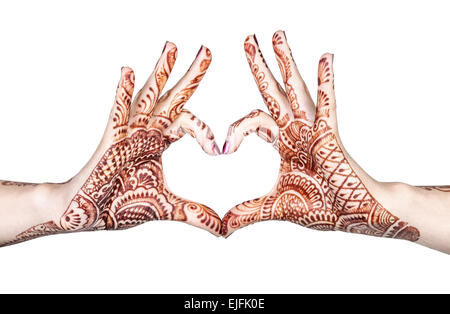 Woman hands with henna doing heart gesture isolated on white background with clipping path Stock Photo