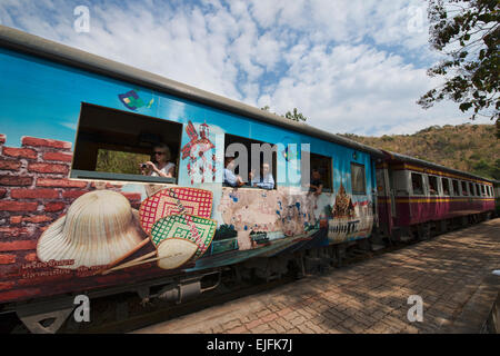 Riding the tourist train commemorating the Burma Death Railway near Kanchanaburi, Thailand Stock Photo