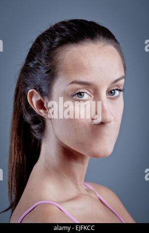 woman without her mouth representing lack of freedom of speech and that there is heavy censorship Stock Photo