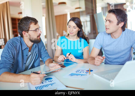 Colleagues analyzing financial data Stock Photo