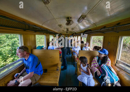 Riding the tourist train commemorating the Burma Death Railway near Kanchanaburi, Thailand Stock Photo