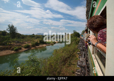 Riding the tourist train commemorating the Burma Death Railway near Kanchanaburi, Thailand Stock Photo