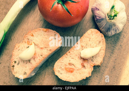 Spanish appetizer with tomatoes and garlic and green onions. Tapas view from above Stock Photo