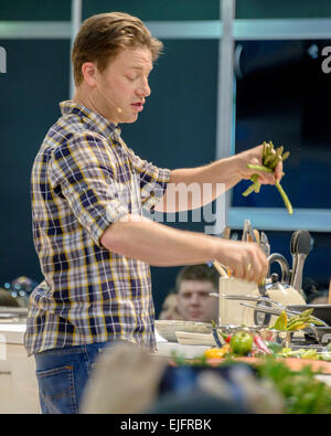 Sydney, Australia. 26th March, 2015. Fresh food campaigner Jamie Oliver cooked up a storm of pan-cooked giant prawns with snow peas on the opening day of the Sydney Royal Easter Show. Credit:  MediaServicesAP/Alamy Live News Stock Photo