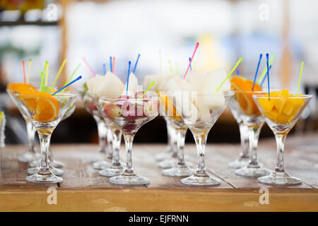 Fresh fruit cuts in champagne glasses for party Stock Photo