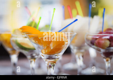 Fresh fruit cuts in champagne glasses for party Stock Photo