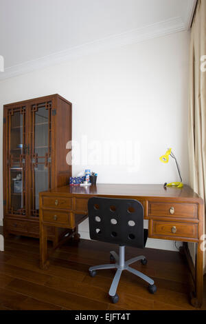 home office with built in wood shelvingand chair Stock Photo