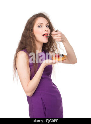 Woman enjoy cake, isolated. Stock Photo