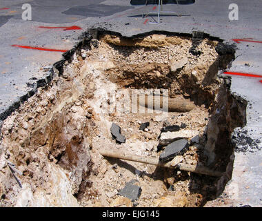 Cut away cross section of a road where maintenance work is being carried out Stock Photo