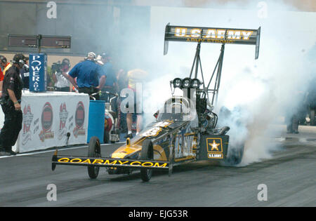 Army Top Fuel driver Tony &quot;The Sarge&quot; Schumacher warms up his tires at the 10th annual Torco Racing Fuels Route 66 National Hot Rod Association Nationals in Chicago. Mr. Schumacher was taken out in the second round of eliminations. photo by Staff Sgt. Jeffrey Duran Stock Photo