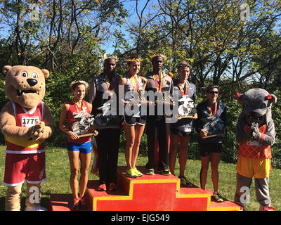 The top finishers of the 39th Marine Corps Marathon. Armed Forces athletes took five of the six spots on the podium, with Army Capt. Meghan Curran and Army Spec. Samuel Kosgei winning the Women's and Men's Division. From left to right: Ms. Lindsey Wilkens 2nd Female; Army Spec. Laban Sialo 2nd Male; Army Capt. Meghan Curran 1st Female; Army Spec. Samuel Kosgei 1st Male; Navy Petty Officer 2nd Class Justin Turner and Navy Lieut. Gina Slaby.  Steven Dinote Stock Photo