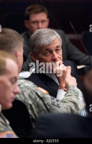 Secretary of the Army John McHugh listens as Commander of the Combined Arms Center Lt. Gen. David G. Perkins briefs during a visit at the U.S. Army Training and Doctrine Command, to discuss how the future force will train to fight and win our nation's wars, April 20, 2012, at Joint Base Langley-Eustis, Va. TRADOC develops, educates and trains soldiers, civilians, and leaders; supports unit training; and designs, builds and integrates a versatile mix of capabilities, formations, and equipment to strengthen the U.S. Army as America's Force of Decisive Action. Stock Photo