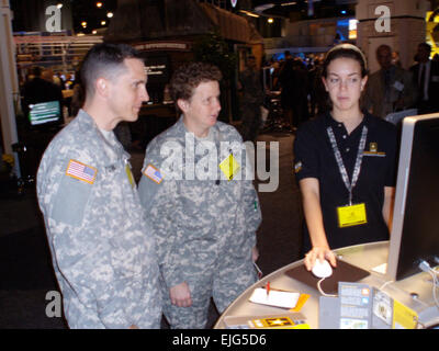 Capt. Daniel Toven and Lt. Col. Beth Steele, both from U.S. Army Europe, get their news updates from www.ARMY.mil  www.ARMY.mil  . Stock Photo