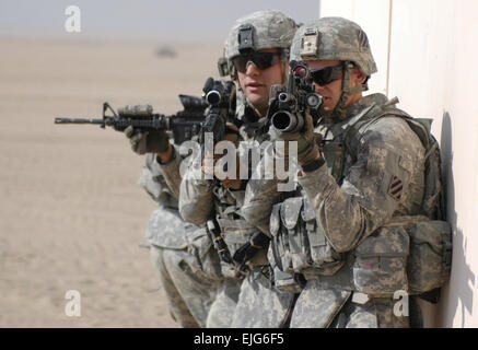 Infantrymen assigned to the 1st Battalion, 15th Infantry Regiment, 3rd Armored Brigade Combat Team, 3rd Infantry Division, stack before clearing and securing a building, one of the final tasks of Hammer Strike, a brigade level exercise conducted at the Udairi Range Complex near Camp Buehring, Kuwait, Wednesday.  Hammer Strike featured the capabilities of an armored brigade and highlighted the soldiers and vehicles of the Sledgehammer Brigade to its Kuwaiti counterparts who were on hand to view the exercise. The Sledgehammer Brigade has been participating in joint training exercises with the Ku Stock Photo