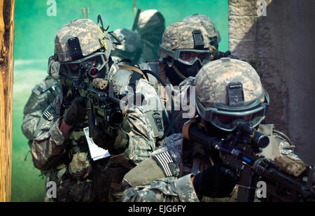 Paratroopers assigned to 1st Battalion, 508th Parachute Infantry Regiment, 4th Brigade Combat Team, 82nd Airborne Division, prepare to enter a building as they conduct close quarters combat training during an air assault mission, Sept. 26.  Sgt. Juan F. Jimenez Stock Photo