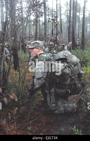 Soldiers take a knee and conduct 360-degree security while a reconnaissance group moves ahead to ensure their path is clear.         Ranger students get swamped in Florida  /-news/2009/12/04/31313-ranger-students-get-swamped-in-florida/index.html Stock Photo