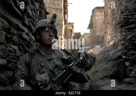 U.S. Army soldiers with 1st Battalion, 102nd Infantry Regiment, 86th Brigade Combat Team, Task Force Iron Gray cordon and search Masamute Bala in Laghman province, Afghanistan, as they provide security on Sept. 25, 2010.   Spc. David A. Jackson, U.S. Army. Stock Photo