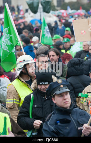 Berlin, Germany. 26th Mar, 2015. Demonstrators stand at Gendarmenmarkt in Berlin, Germany, 26 March 2015. They are following the labour union verdi's call for warning strikes. Photo: PAUL ZINKEN/dpa/Alamy Live News Stock Photo