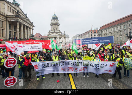 Berlin, Germany. 26th Mar, 2015. Demonstrators stand at Gendarmenmarkt in Berlin, Germany, 26 March 2015. They are following the labour union verdi's call for warning strikes. Credit:  dpa picture alliance/Alamy Live News Stock Photo