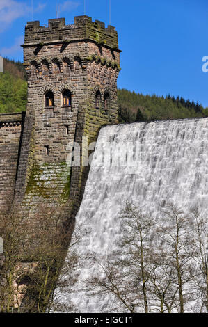 Water cascading down Derwent dam in the Peak District, Derbyshire. A sunny spring day. Stock Photo