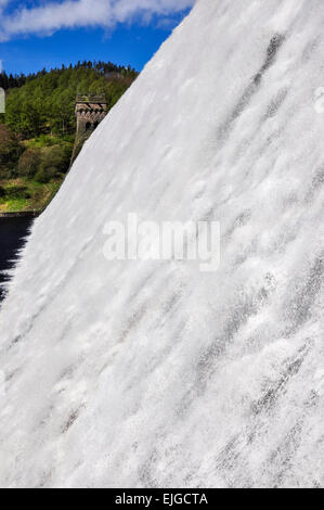 Water cascading down Derwent dam in the Peak District, Derbyshire. A sunny spring day. Stock Photo