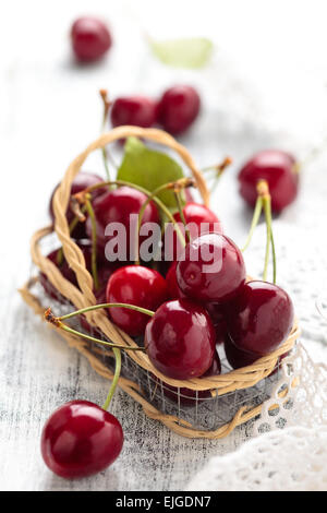 a small crate with cherries in the garden Stock Photo - Alamy