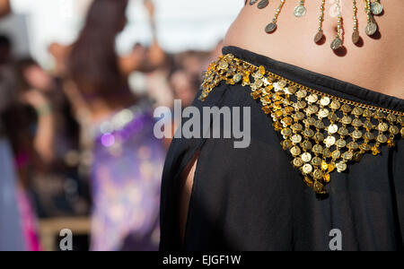 Belly dancers detail dancing with arabic music street band at the Almossasa  Festival, Marvao, Portugal Stock Photo - Alamy