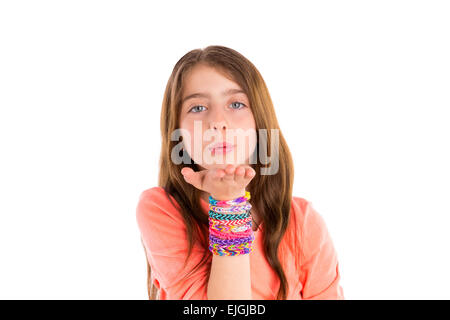 Loom rubber bands bracelets blond kid girl blowing hand on white background Stock Photo